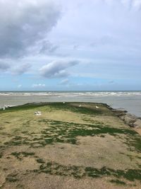 Scenic view of beach against sky