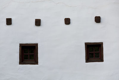 Windows of a traditional house in spania dolina village.