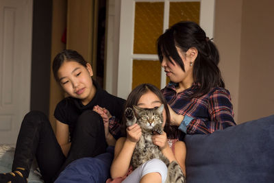 Young woman sitting at home