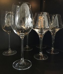 Close-up of wine glasses on table