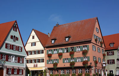 Low angle view of buildings in city against sky