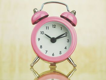Close-up of alarm clock on table