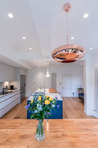 Flower vase on table at home