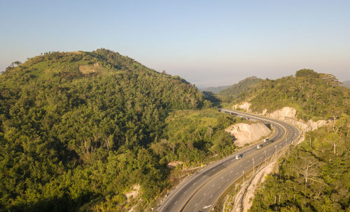 High angle view of road by mountain against sky