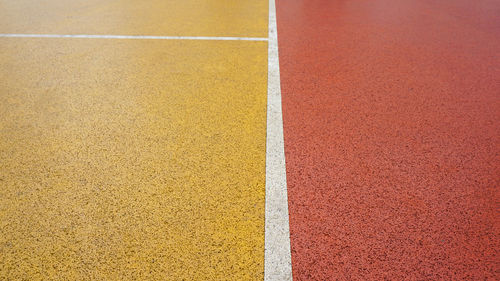 Close-up of yellow basketball court