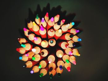 Close-up of colorful illuminated lights against black background