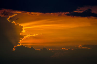 Low angle view of dramatic sky during sunset