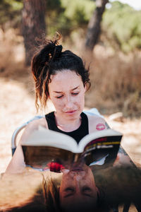 Portrait of woman sitting outdoors