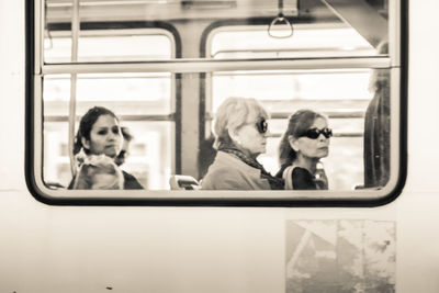 Portrait of man sitting in train