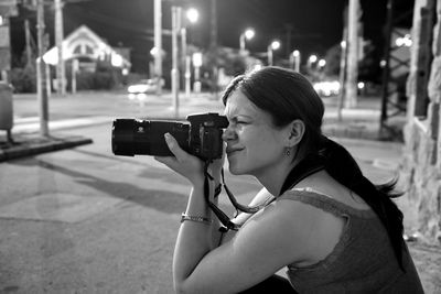 Portrait of woman photographing