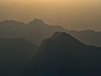 Scenic view of mountains against sky during sunset