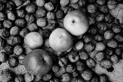 Full frame shot of walnuts and apples