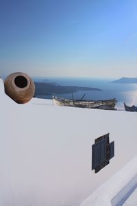 Low angle view of trees against clear blue sky
