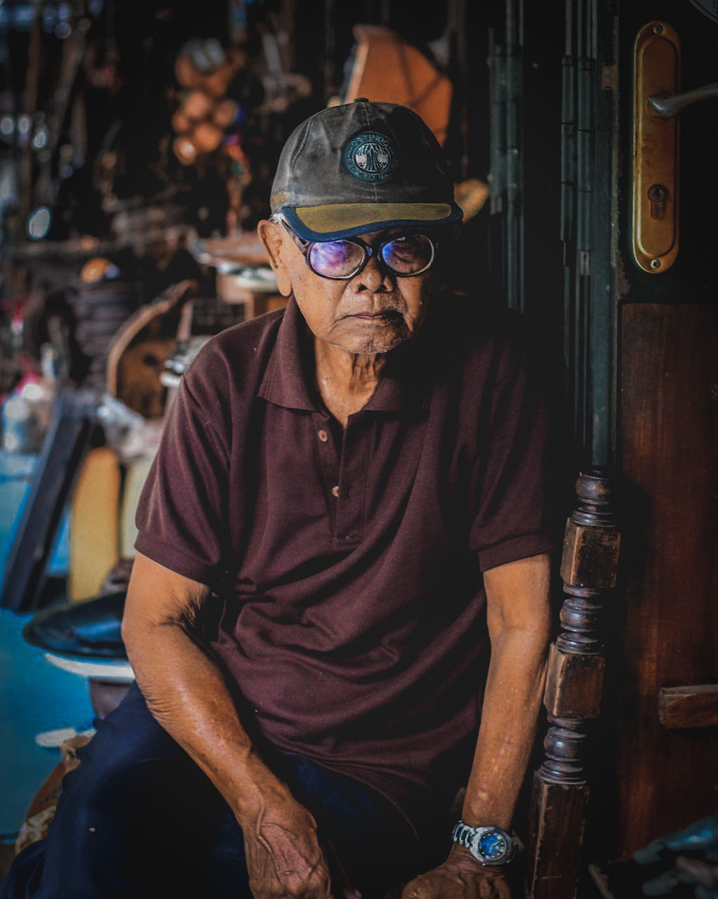 adult, one person, men, occupation, glasses, person, business finance and industry, working, portrait, front view, waist up, looking at camera, eyeglasses, workshop, indoors, manual worker, human face, mature adult, sitting, business, clothing, three quarter length, senior adult