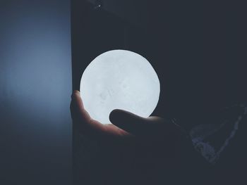 Close-up of hand holding moon