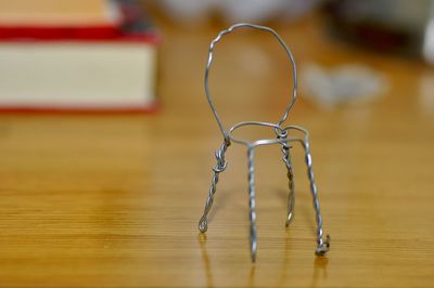 Close-up of metal object on wooden table