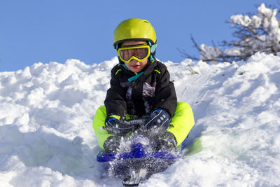 Man skiing on snow covered landscape