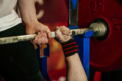 Male athlete and barbell exercise bench press