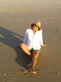 Full length of young woman on beach