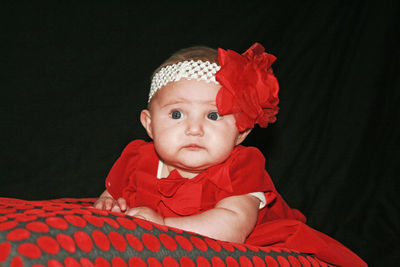 Portrait of cute baby girl in bed