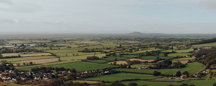 Panoramic view of fields and farms from mendip hills, uk, on a sunny autumn day.