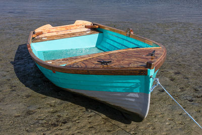 High angle view of boat moored on beach