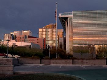 Buildings against sky in city at dusk