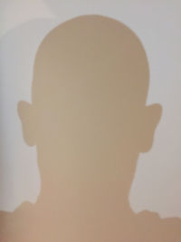 Close-up portrait of silhouette man against wall