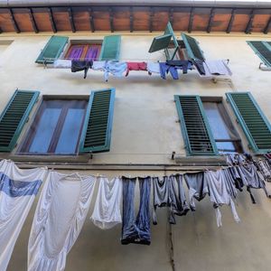 Low angle view of clotheslines on building