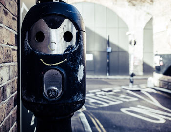 Close-up of clock on street in city