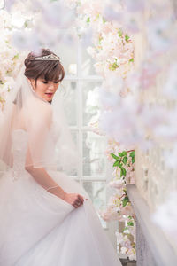 Side view of bride standing in wedding ceremony