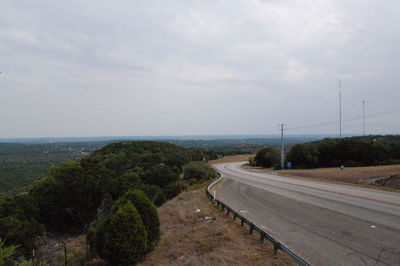 Road by sea against sky