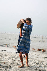 Full length of boy on beach