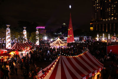 Panoramic view of crowd at night