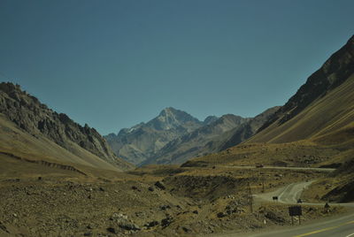 Scenic view of mountains against clear blue sky