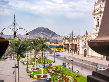 Panoramic view of city street and buildings against sky