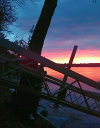 Silhouette of bridge against sky at sunset