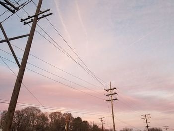 Low angle view of electricity pylon against sky