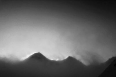 Low angle view of mountain against sky at night