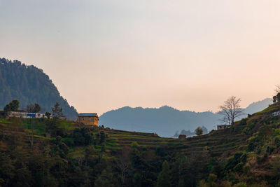 Scenic view of mountains against sky during sunset