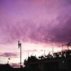 Low angle view of silhouette trees against sky during sunset