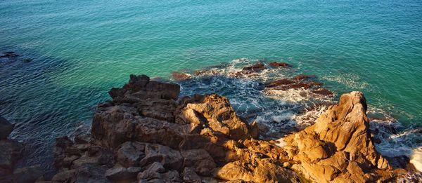 High angle view of rock formation in sea