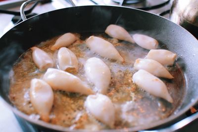 Close-up of meat in frying pan