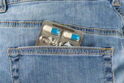 Close-up of blister pack in jeans pocket