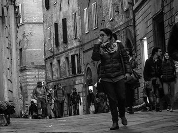 Woman standing on city street