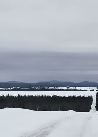 Scenic view of frozen lake against sky