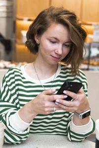 Young woman using mobile phone