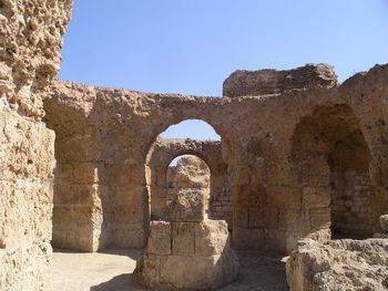 View of old ruins against clear blue sky