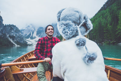 Portrait of friends against lake