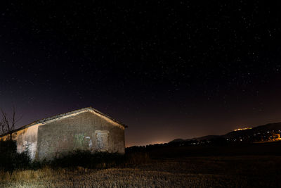 Scenic view of field against sky at night